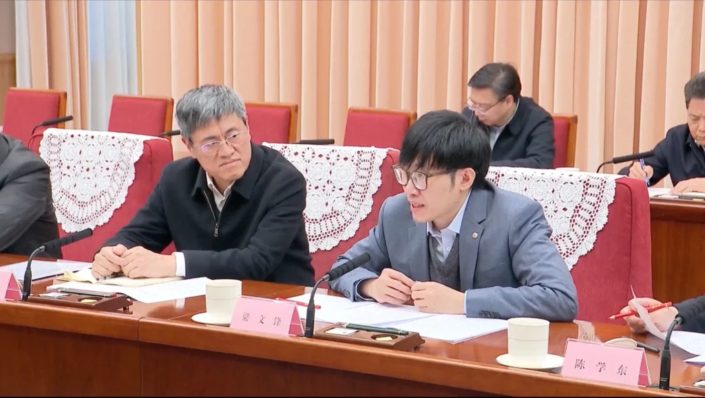 Liang Wenfeng (right) at a conference chaired by Premier Li Qiang on January 20. Photo: CCTV